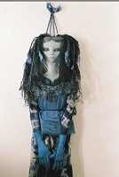 blue haired wax doll