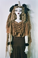 brown paper mache doll